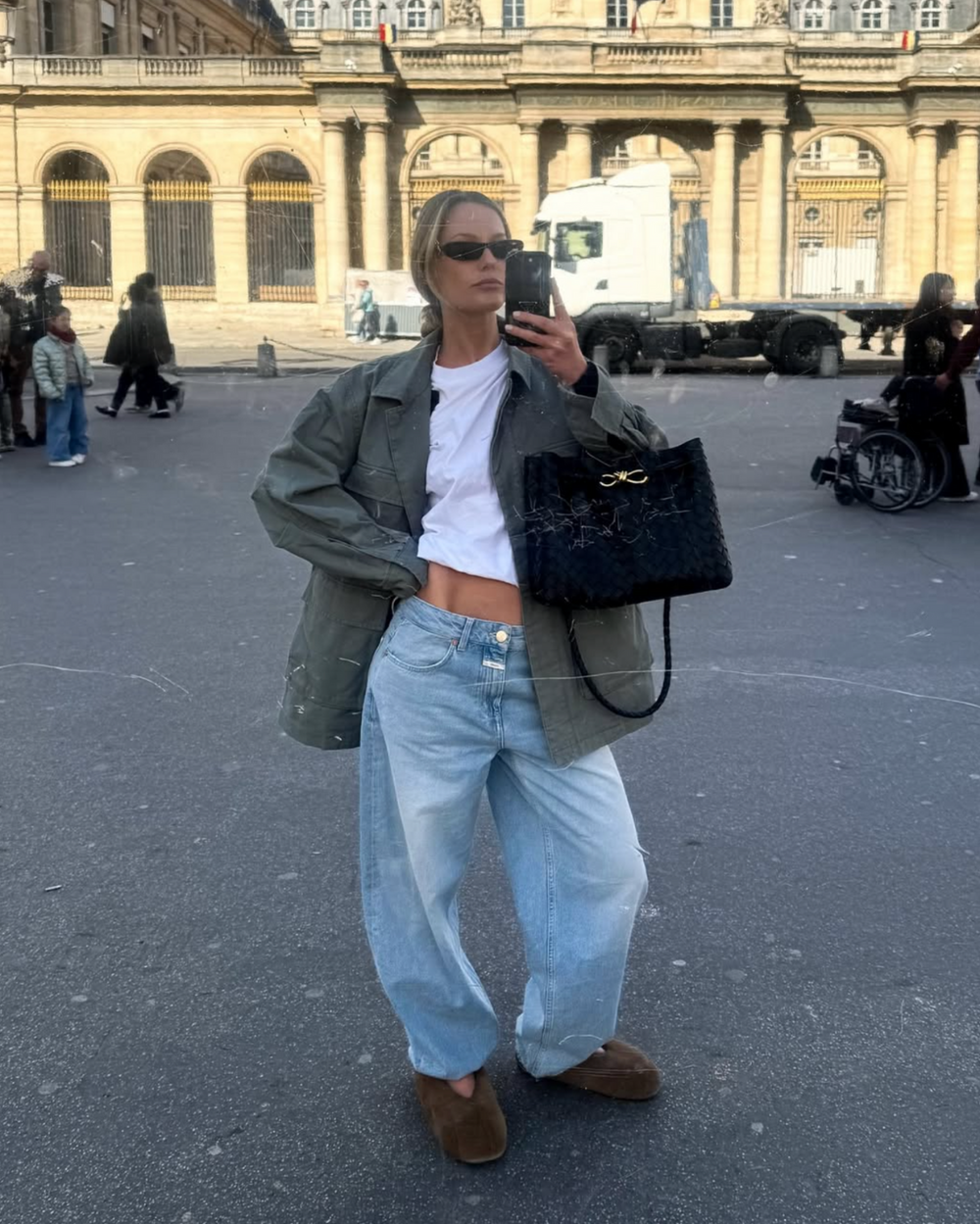 Woman wears Saint Laurent SHADE sunglasses
