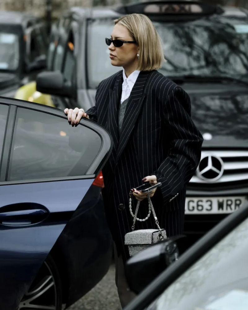 Woman wearing shade saint laurent sunglasses