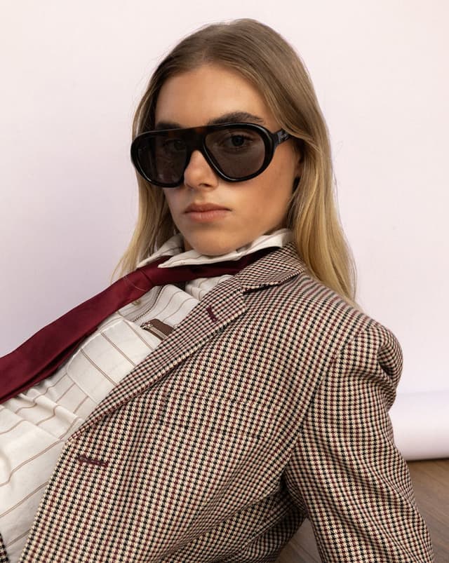 A model wearing oversized prada sunglasses.