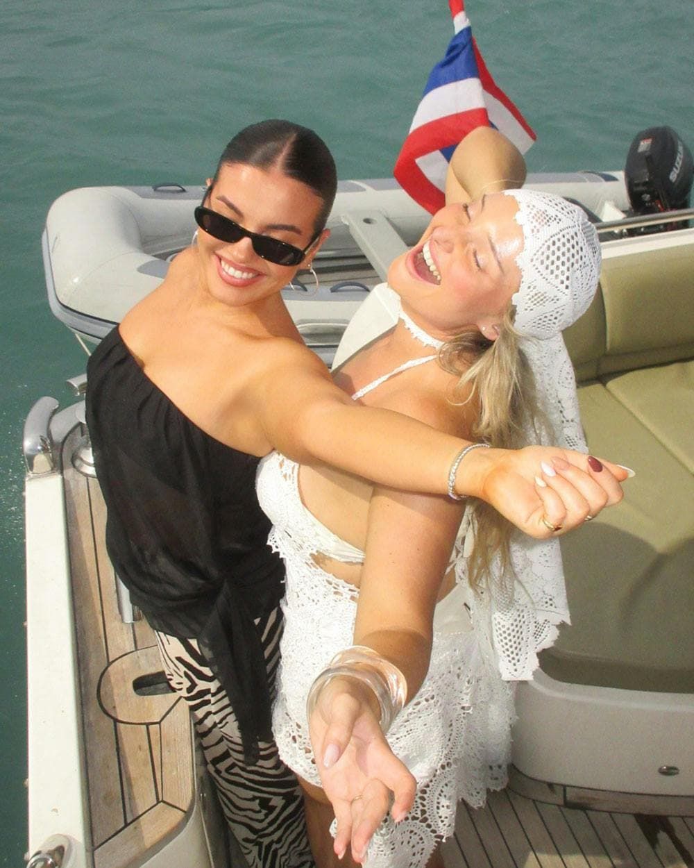Jaz hand and Riley J dance in a boat in thailand 